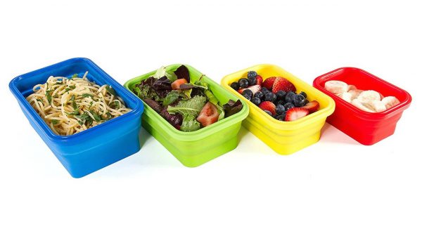 spaghetti, salad, berries, and bananas in tupperware containers