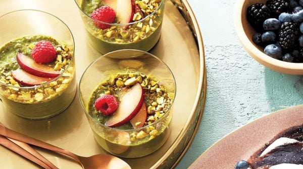 Matcha chia pudding recipe in cups on a gold platter