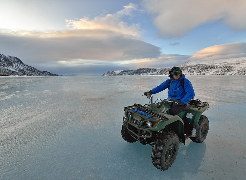 best outdoor winter activities-Nunavut-Tourism-man sits on ATV on a frozen lake