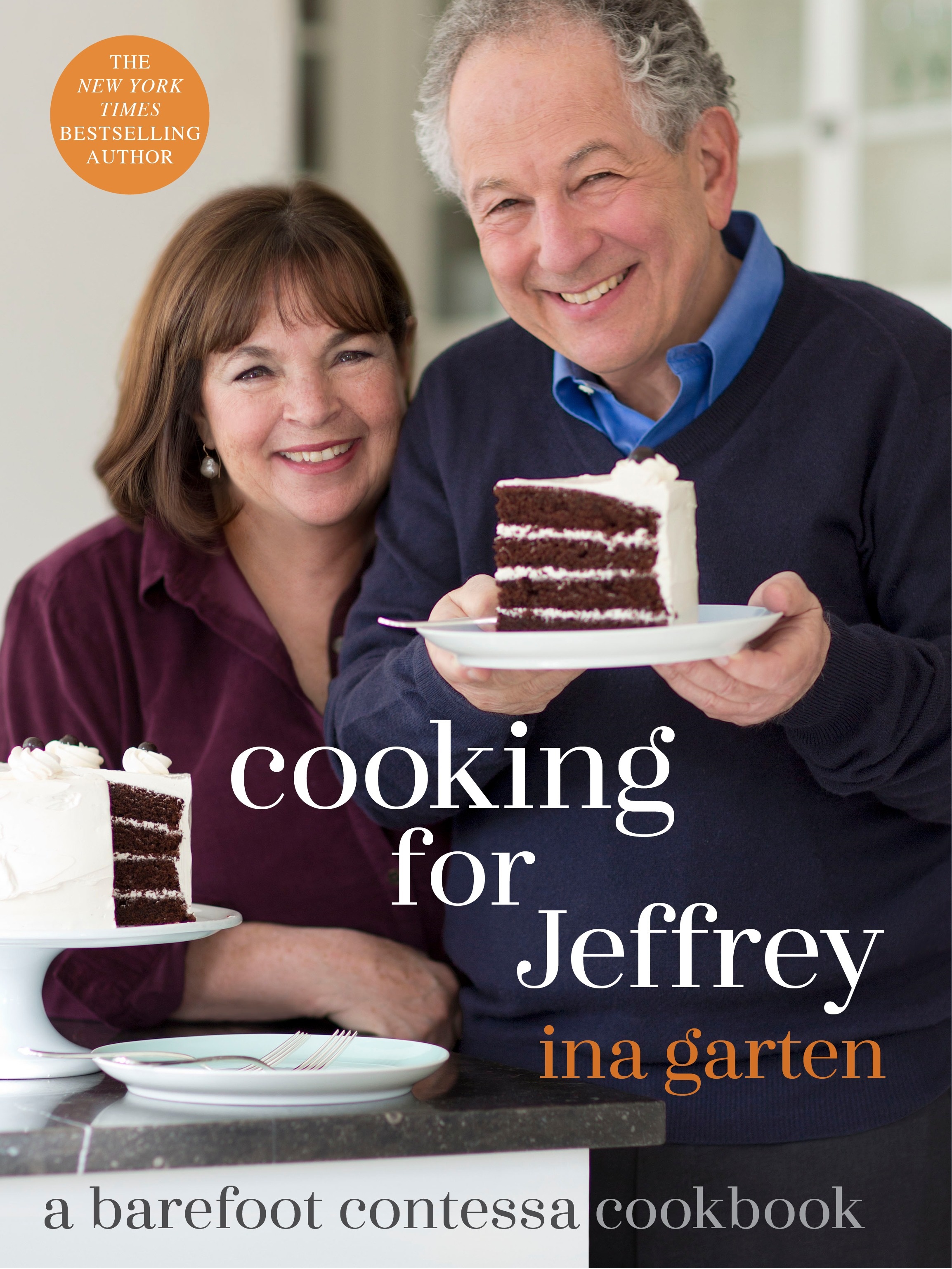 Ina Garten wth husband Jeffrey holding cake.