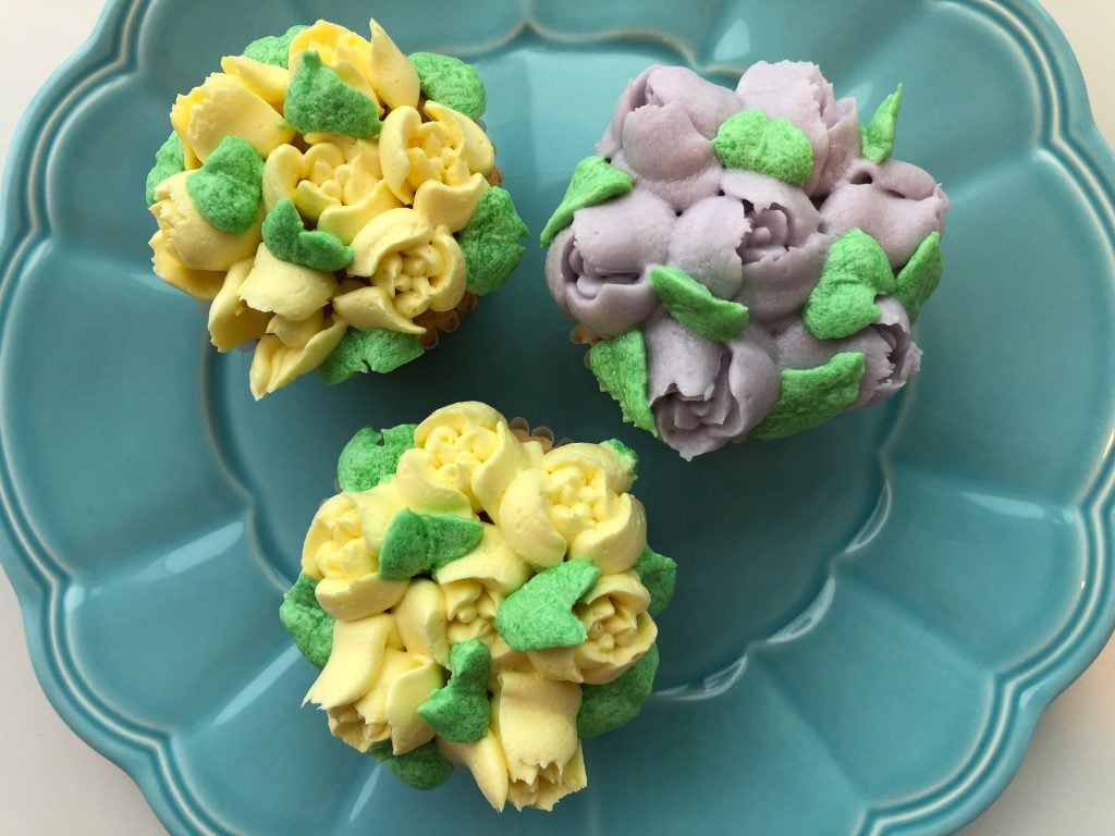 buttercream icing from the Violet Bakery Cookbook used to create a floral design on cupcakes