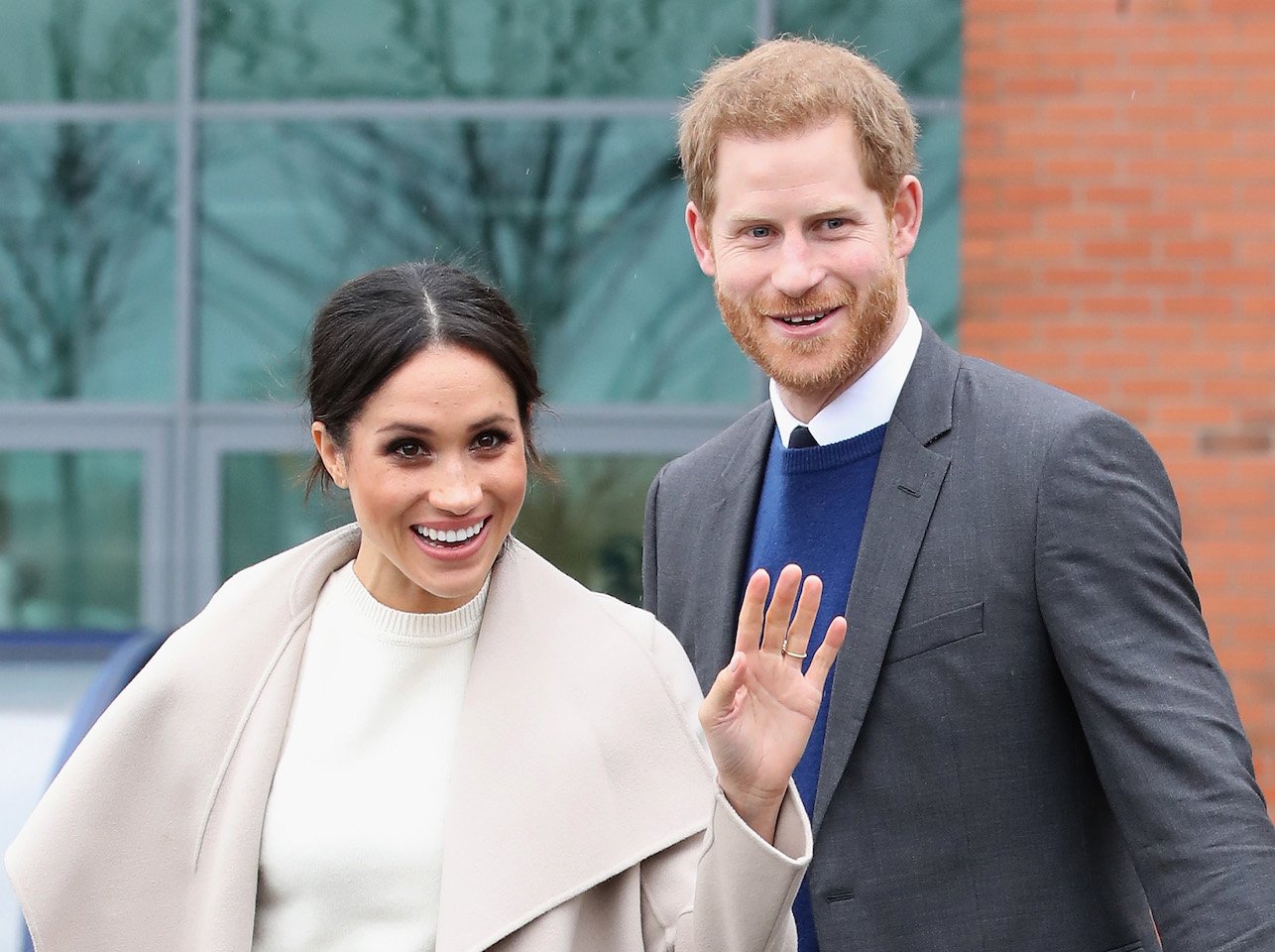 Meghan Markel royal title possibilities-Meghan and Prince Harry stand smiling and waving at the camera