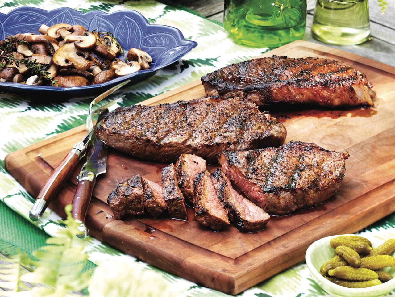 grilled steak on a wooden cutting board