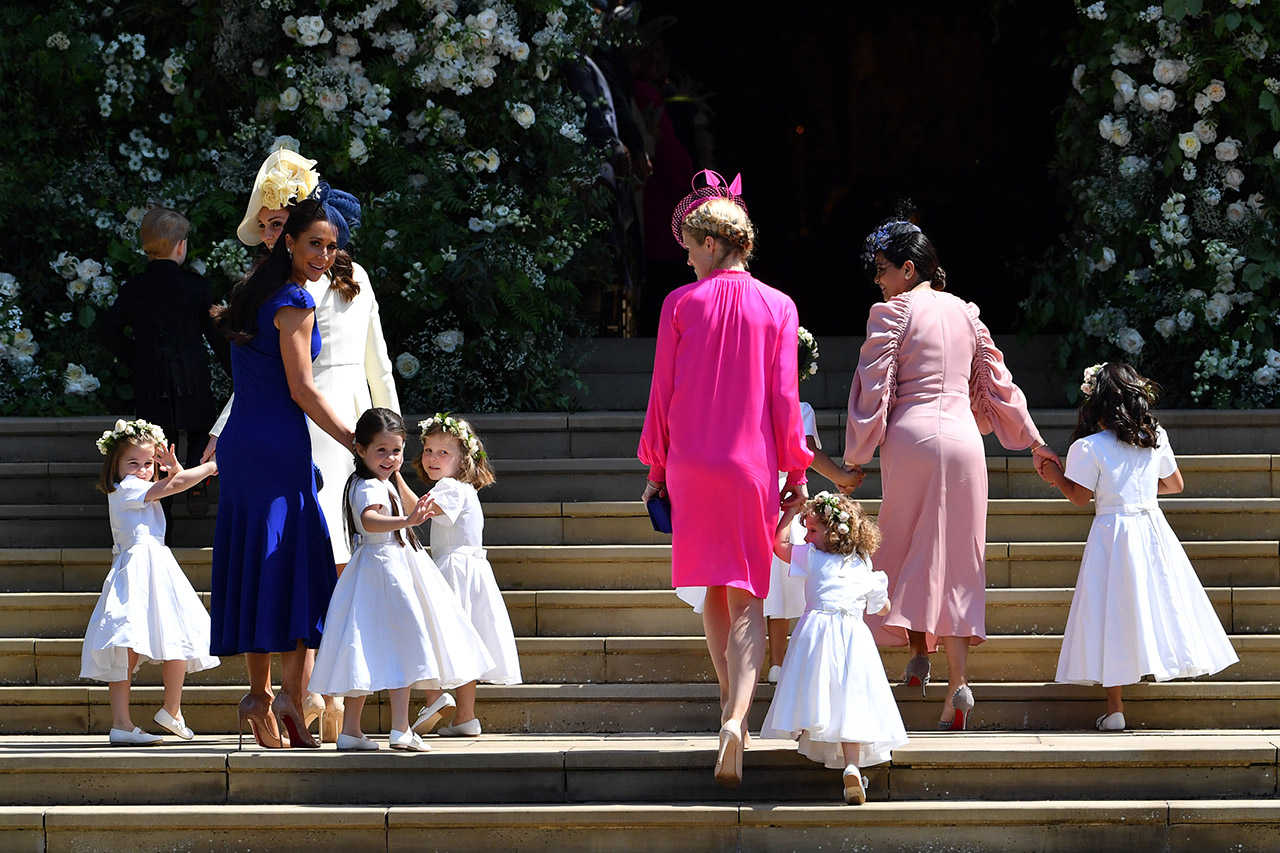 Jessica Mulroney holds the bridesmaids' hands at the royal wedding