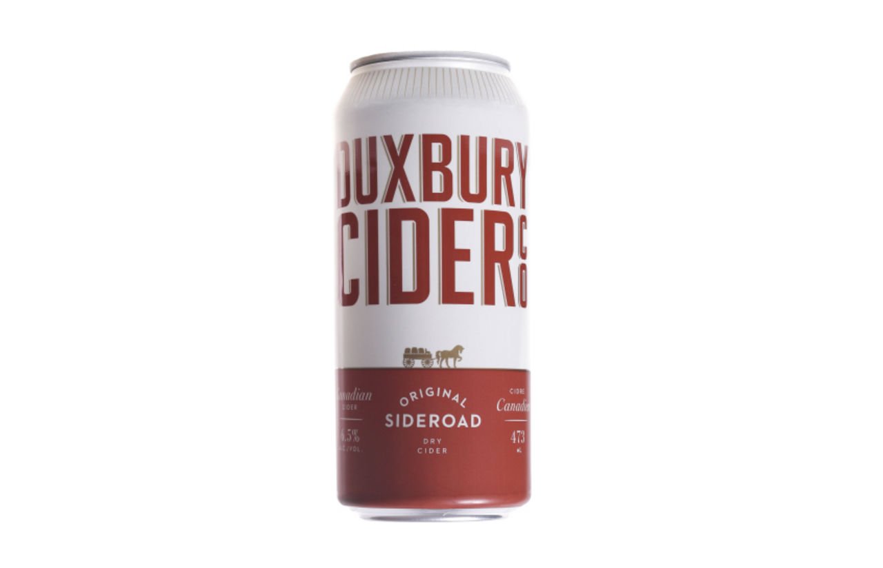 duxbury cider co. dry hopped cider in red and white can
