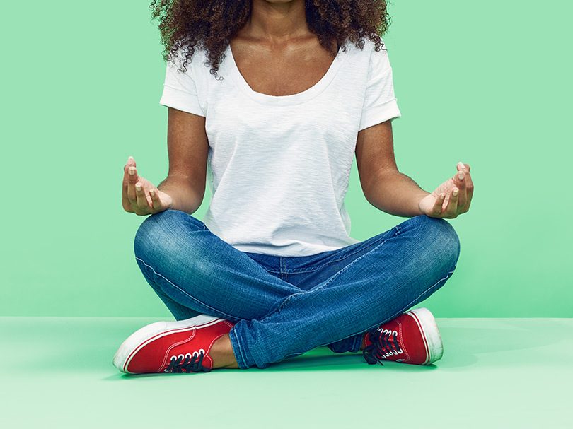A woman meditating. Mindfulness meditation has been shown to improve executive brain function, reduce stress and manage pain