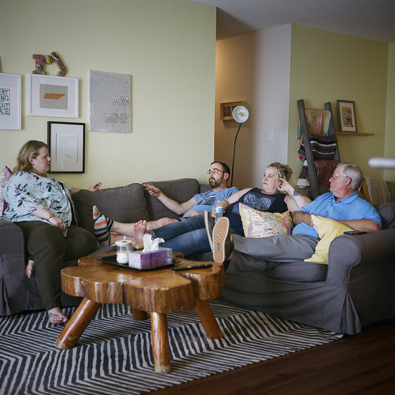 early-onset Alzheimer's at 41-Jo and family relax on the couch.