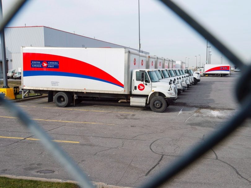 Canada Post strike 2018 photo shows idle trucks sitting in the parking lot of the Saint-Laurent sorting facility in Montreal