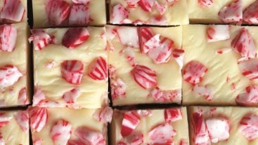 White chocolate fudge squares topped with chopped candy canes.