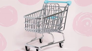 mindless shopping-empty shopping cart on a pink background