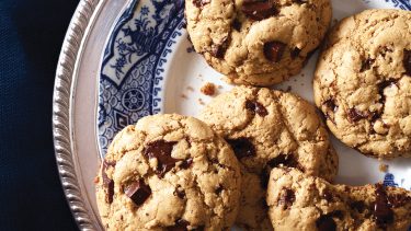 Gluten-free crispy and chewy chocolate-chip cookies on plate