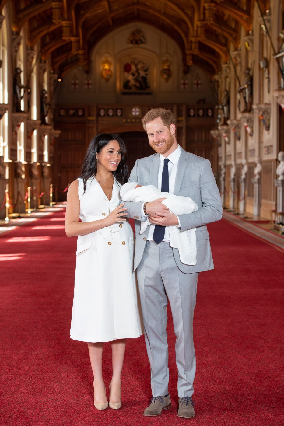 Prince Harry, and Meghan, Duchess of Sussex, pose for a photo with their newborn baby son