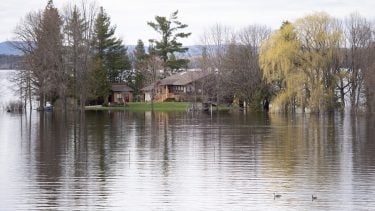 A home by the Ottawa River in Whitewater Region, east of Pembroke, Ontario completely surrounded by water.