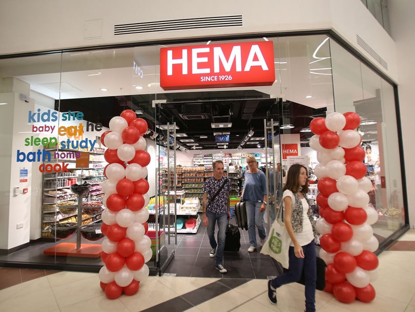 Red and white balloon towers next to HEMA's first UK store's doors as shoppers walk out: HEMA opening in Canada soon