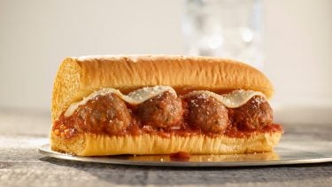 Picture of Subway Beyond Meat Meatball sub on a glass plate.