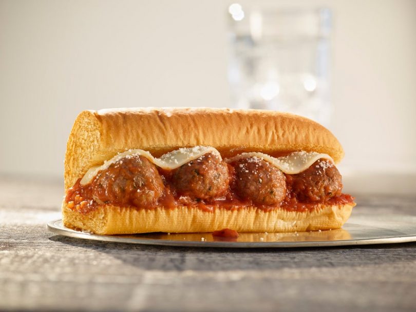 Picture of Subway Beyond Meat Meatball sub on a glass plate.