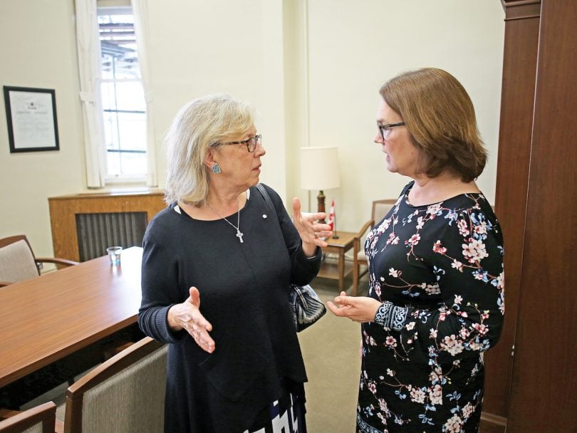 Independent MP Jane Philpott (R) greets Green Party Leader Elizabeth May in her office on Parliament Hill in Ottawa.