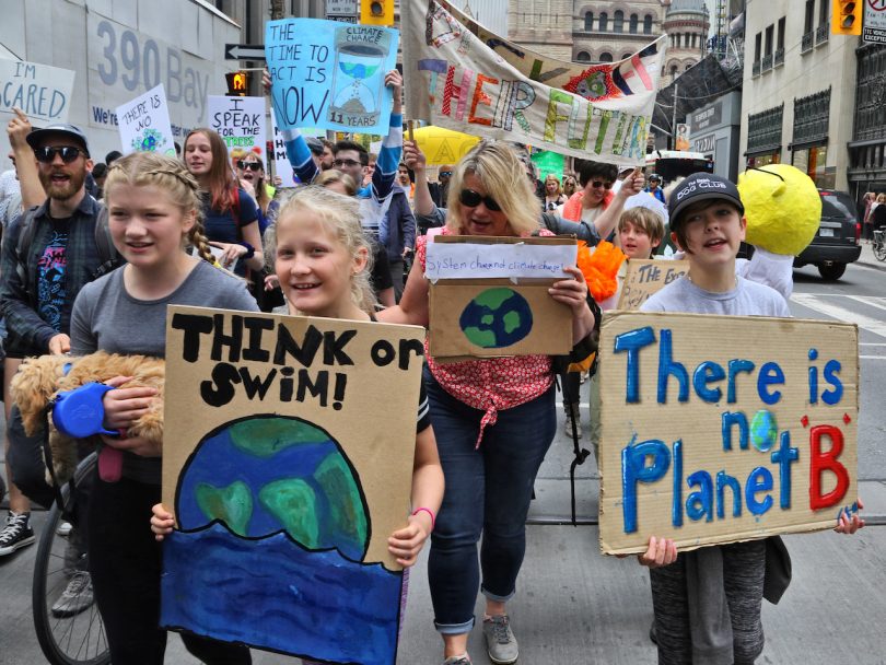hundreds of Canadian children march in protest in downtown Toronto to protest climate change and demand government action