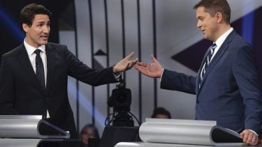 Conservative leader Andrew Scheer, right, and Liberal leader Justin Trudeau gesture to each other as they both respond during the Federal leaders debate in Gatineau, Que. on Monday, October 7, 2019. THE CANADIAN PRESS/Justin Tang