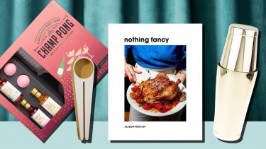 food gifts like champong and cookbooks on a blue curtained background