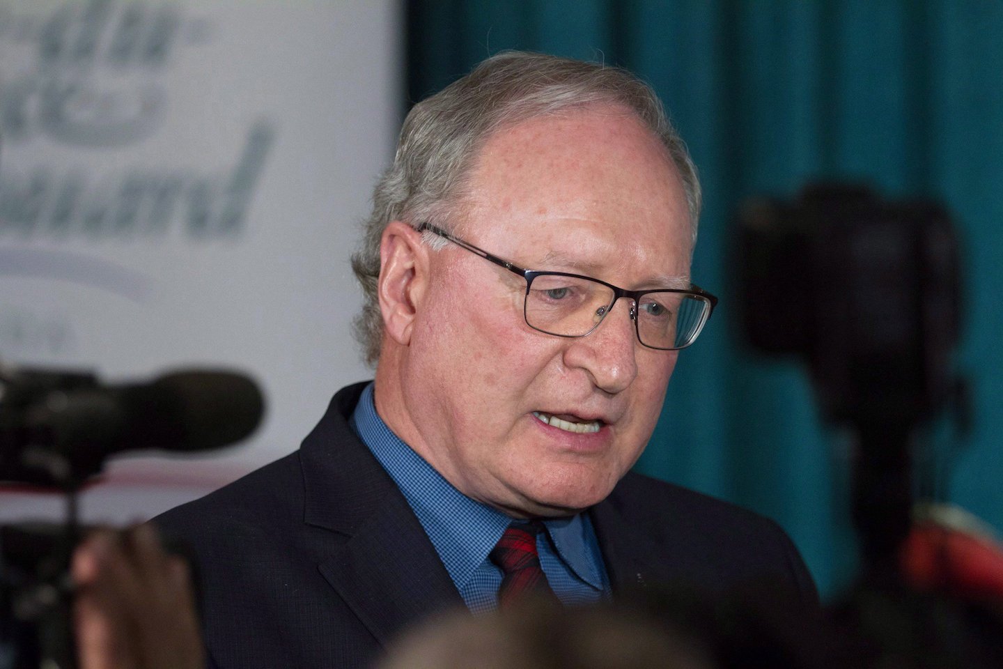 PEI abortion access-Prince Edward Island Premier Wade MacLauchlan speaking into a microphone