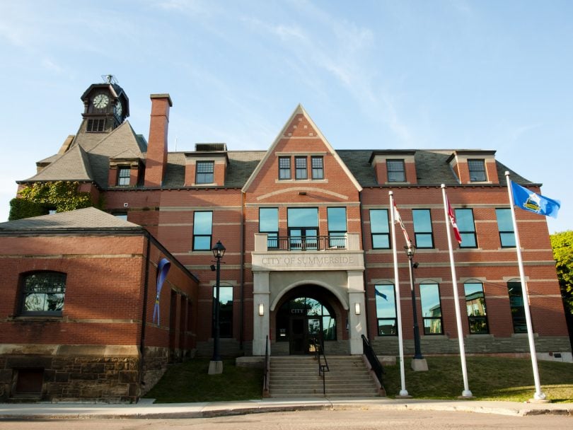 PEI Abortion Access-big brick building with three flagpoles outside