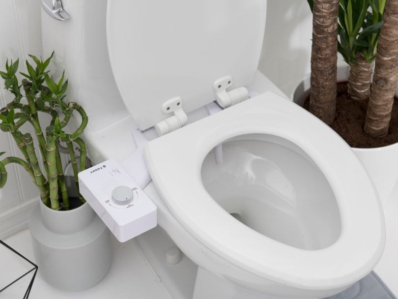 Tushy bidet hooked up to a white toilet