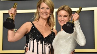 Laura Dern and Renee Zellweger at the 2020 Academy Awards, both holding statuettes