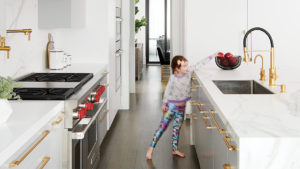 A young girl in a beautiful clean kitchen to illustrate the FlyLady cleaning method.