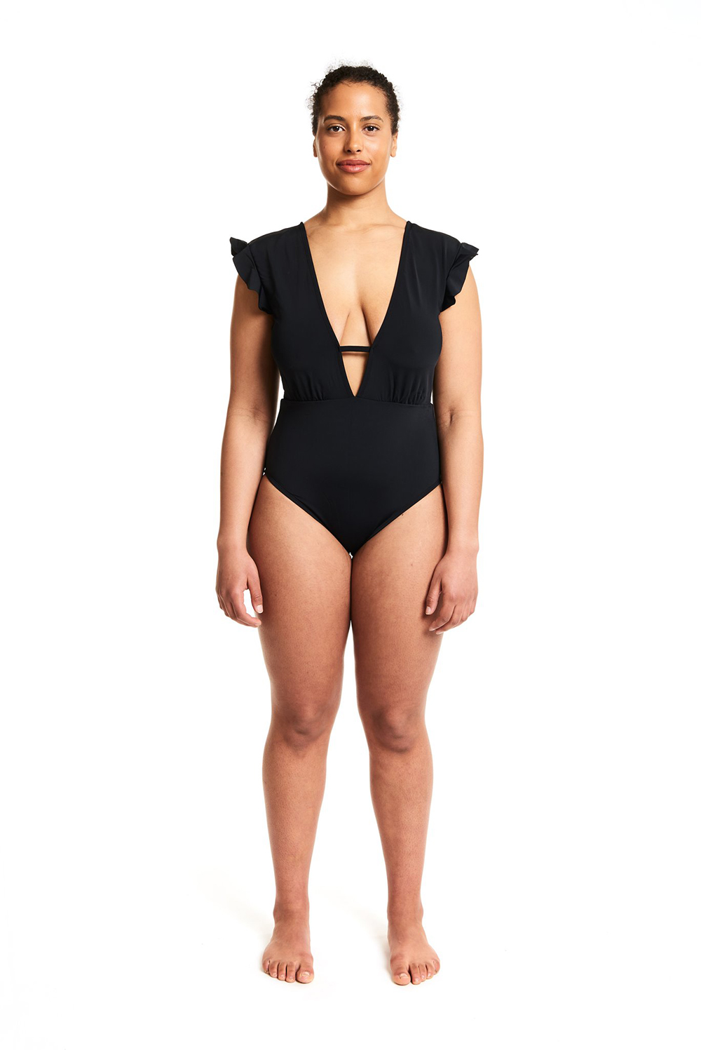 A model wearing a black fluttery one-piece swimsuit from Beth Richards.