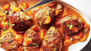Learn how to braise meat: orange soy-braised chicken thighs on white platter