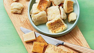 Parmigiano-Reggiano Rind Croutons in small green bowl