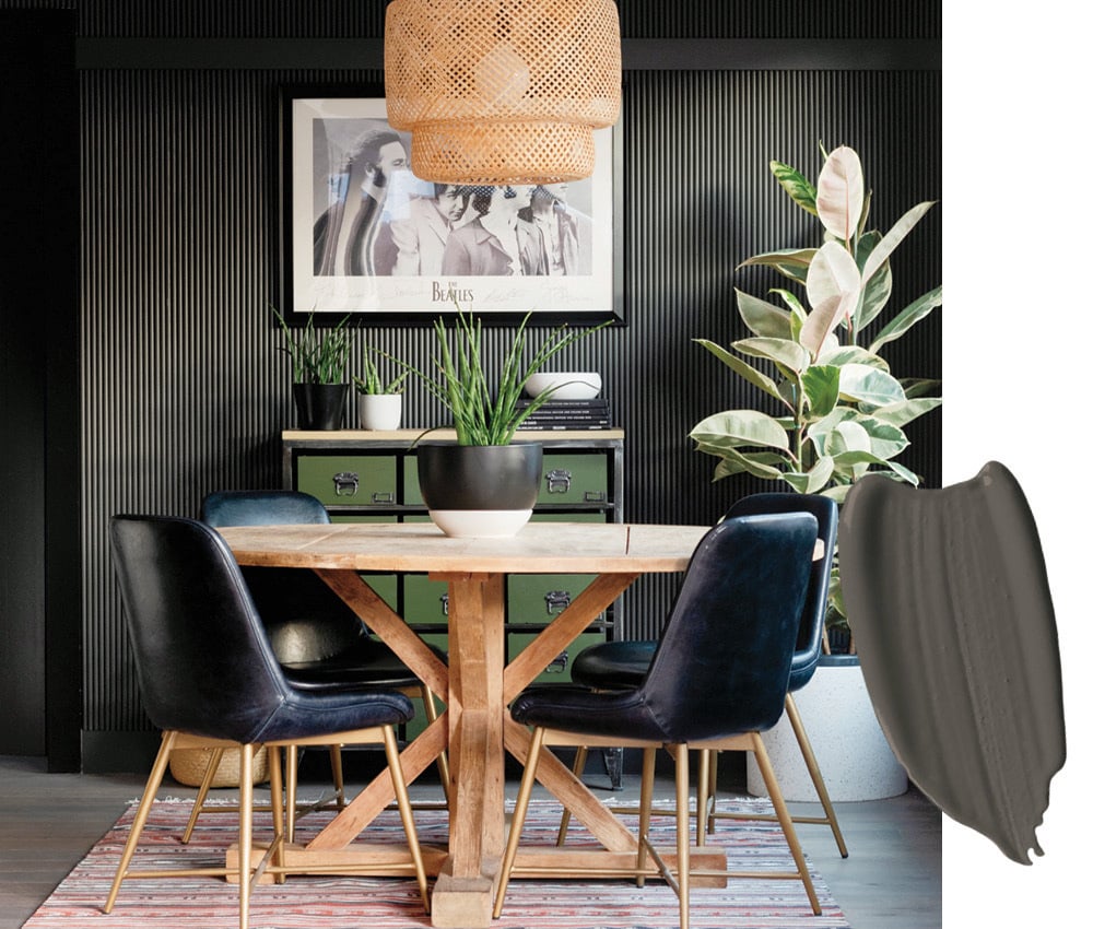 A dining table against a wall painted in Sherwin-Williams Urbane Bronze, which is blend of deep chocolate and modern grey