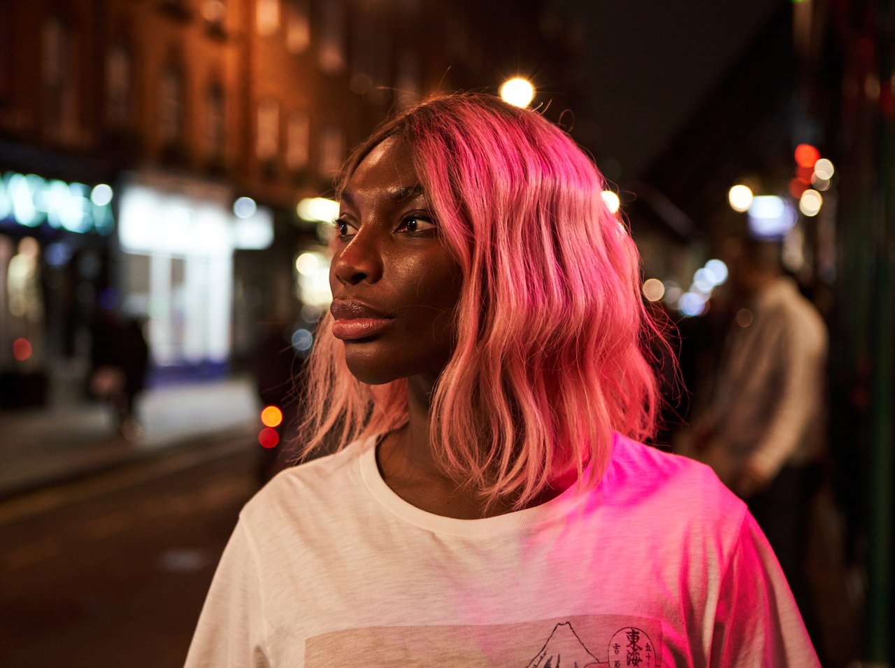 A photo of actor and creator Michaela Coel, a black woman with pink hair, from 'I May Destroy You'