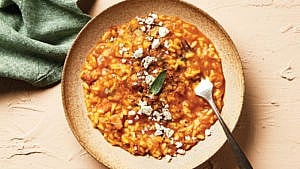 Instant Pot Pumpkin Risotto with sage and cheese garnish