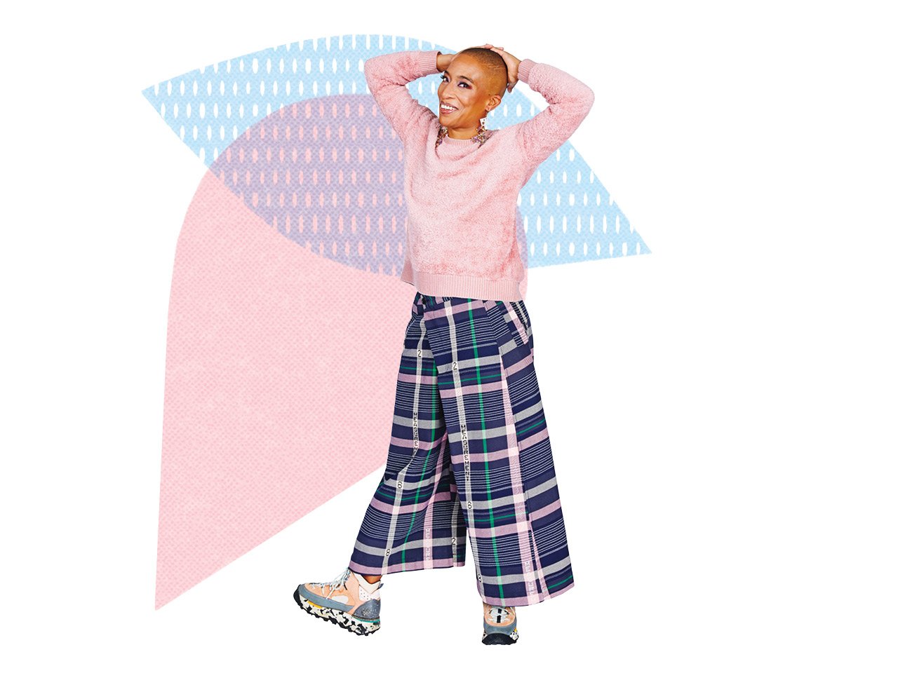 Sweater: Topshop. A woman putting her hands on her head, wearing a pink sweater and plaid pants.