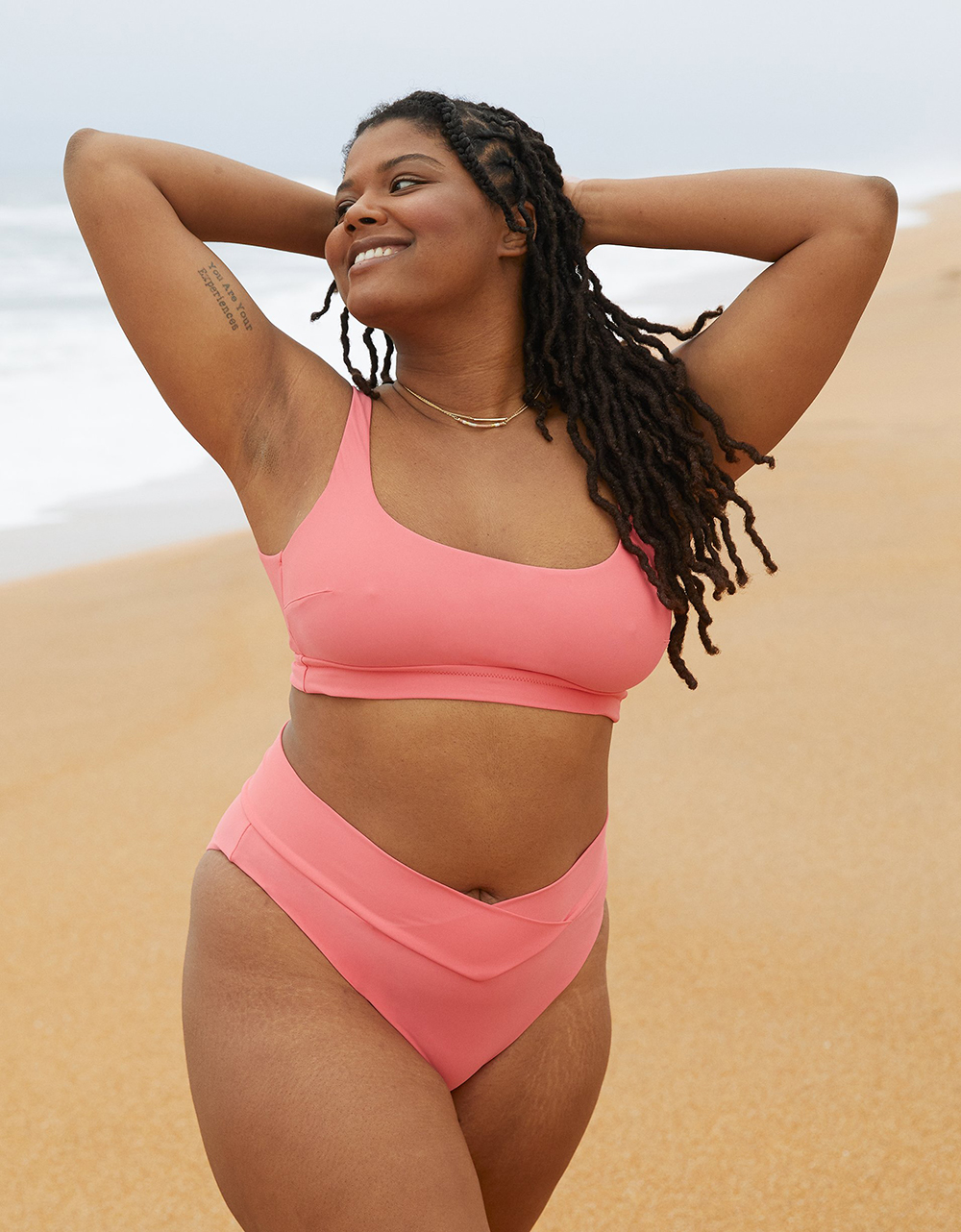 A model wearing a pink bikini from Aerie.