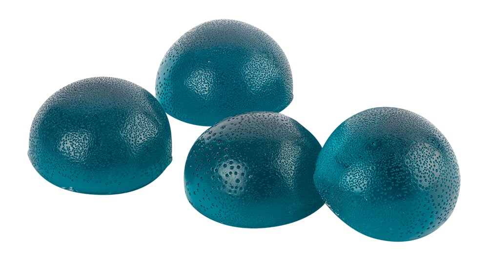 A close up of four blue San Rafael ’71 Blasberry Soft Chews weed gummies