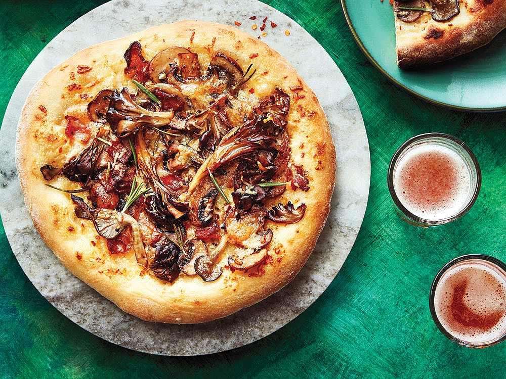 MUSHROOM PIZZA on a marble pizza plate