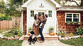 Artist Richelle Bergen and her family outside their cozy Manitoba home.