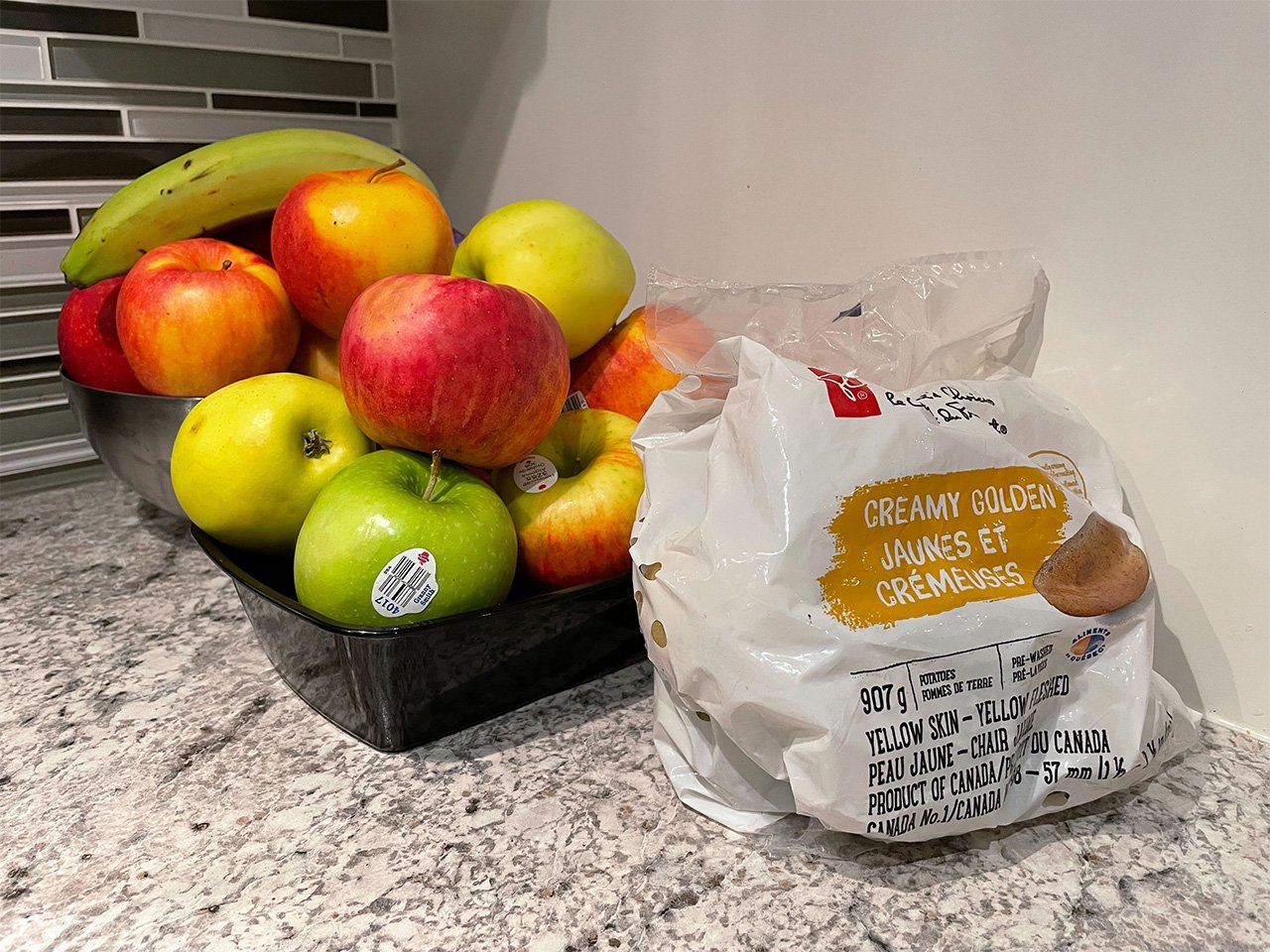 Apples, a banana and a package of potatoes from Loblaws