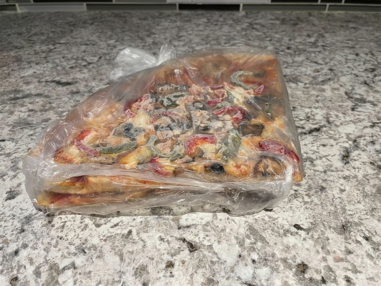 Slice of Toronto pizzas on a kitchen counter