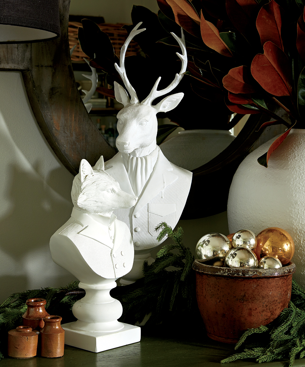 “They’re white but they’re still quirky,” says Meg about these stag and fox busts.