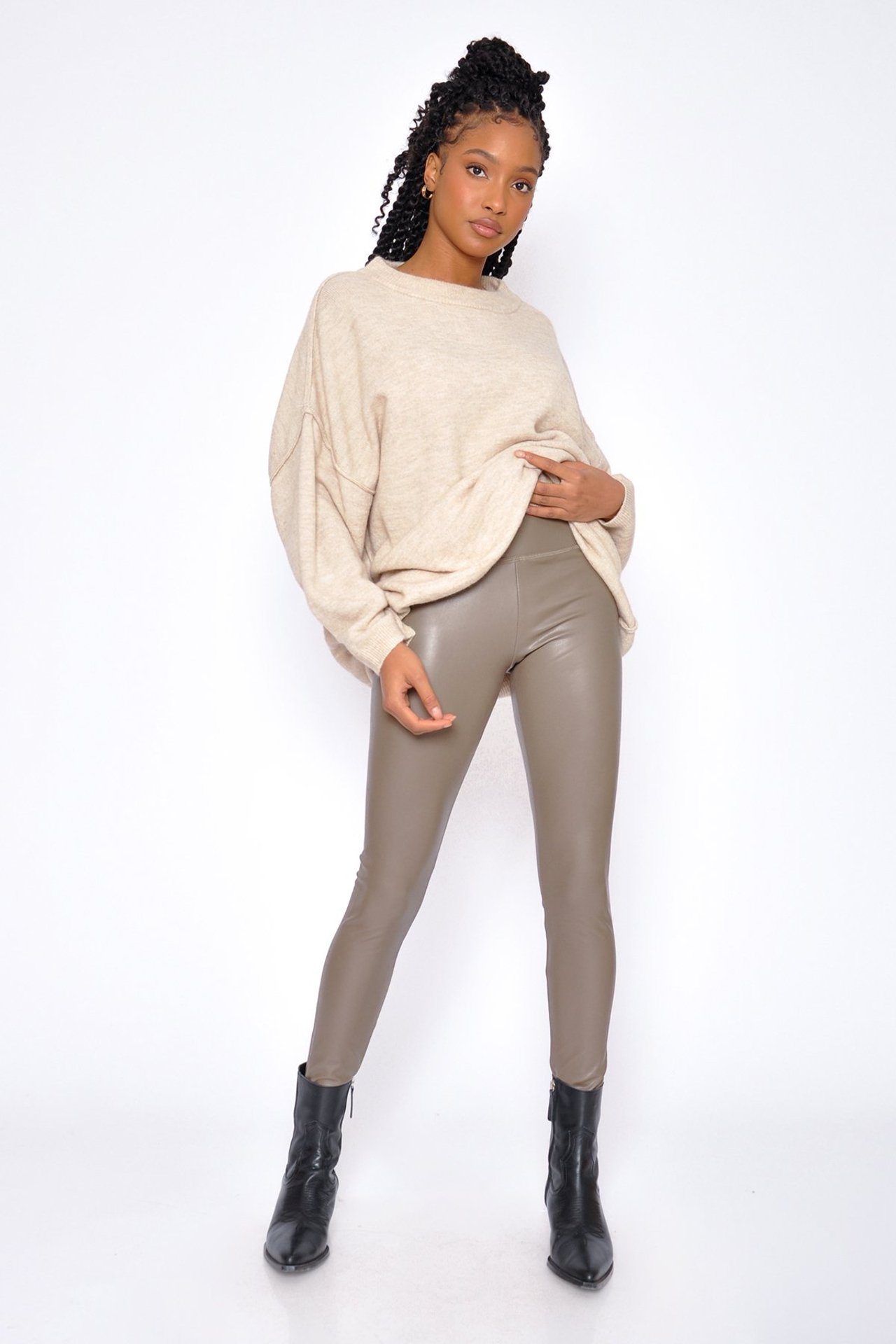 Woman wearing nude coloured leather pants