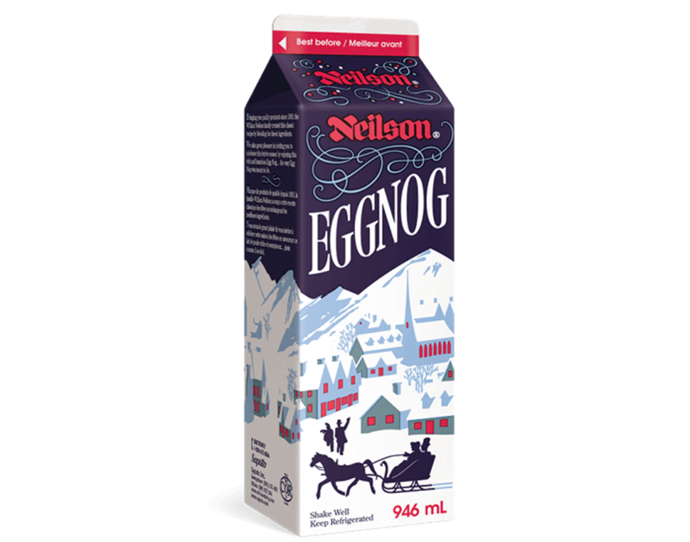A white and black eggnog carton with illustration of a snowy village and a horse drawn carriage