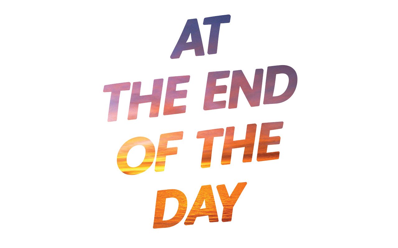 All-caps text that reads "At The End Of The Day"