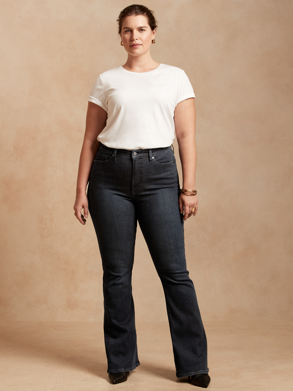 A model wearing a pair of black jeans from Banana Republic