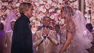 screengrab of Marry Me trailer with Jennifer Lopez and Owen Wilson getting married on stage
