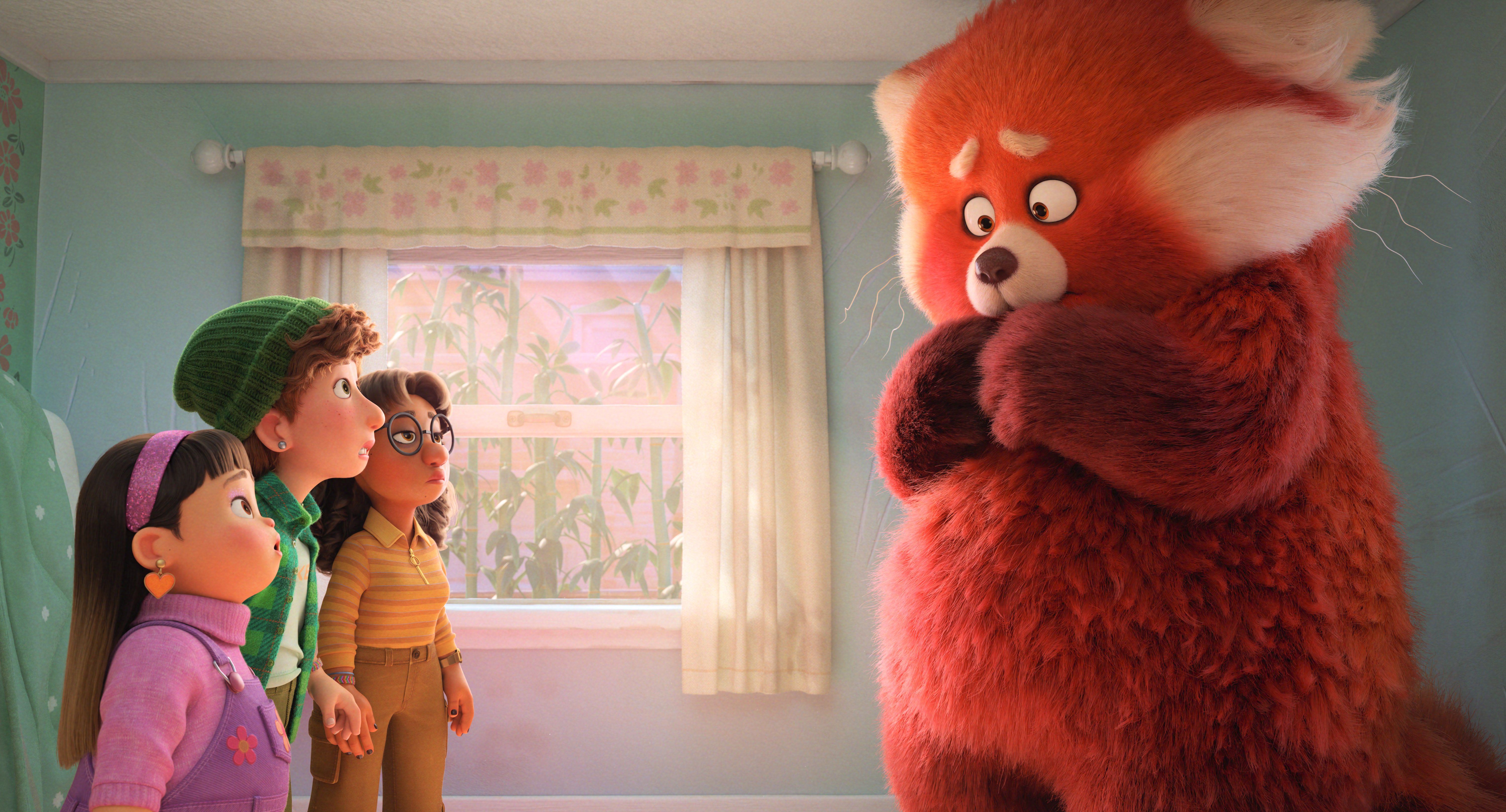 A still from Turning Red, where Meilin's friends are staring at her in her giant red panda form
