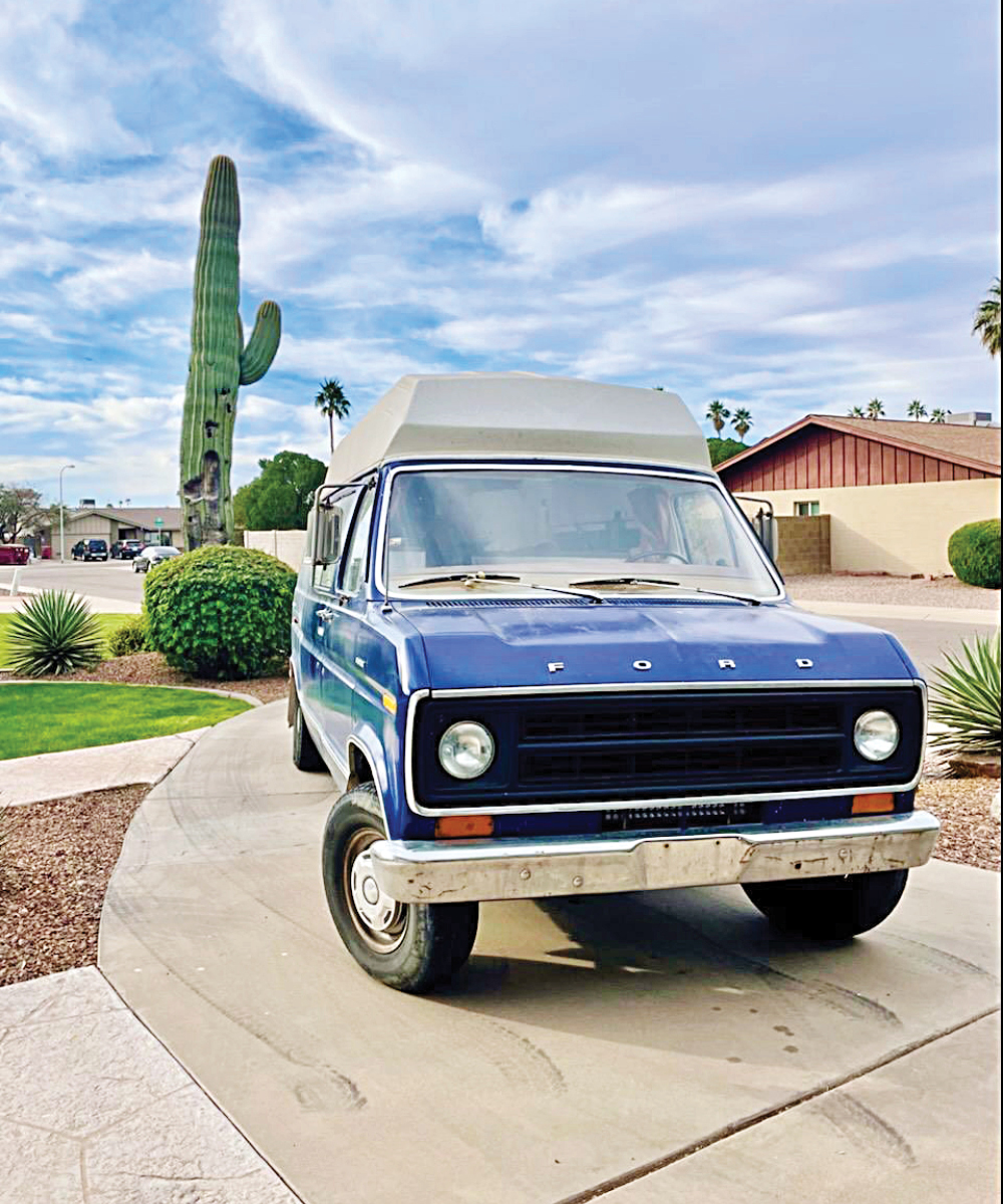 1997 Blue Ford Econoline parked in a driveway.